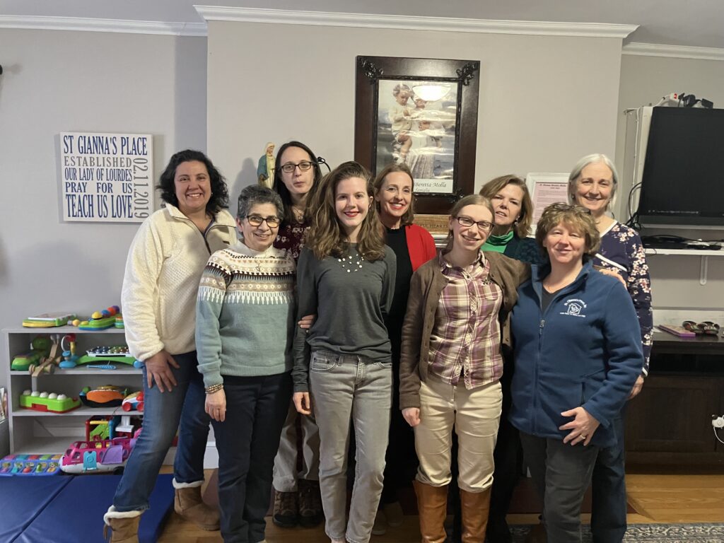 Photo of 9 women who make up the staff at St. Gianna's Place